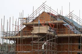 Houses under construction on a housing development. PIC: Andrew Matthews/PA Wire