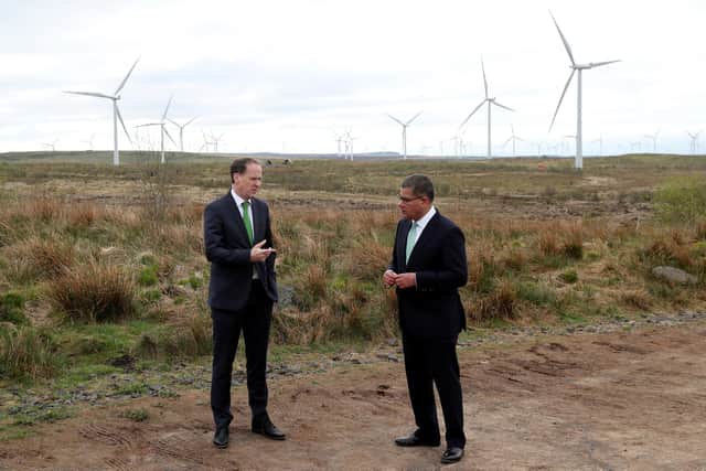 COP26 President, Alok Sharma (right) speaking with Scottish Power Chief Executive Keith Anderson at Whitelee Windfarm near Glasgow today.