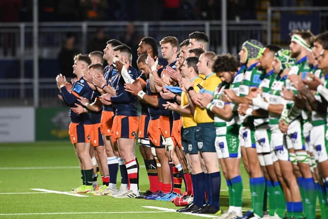 Edinburgh and Benetton players line up for a minute's applause in memory of Siobhan Cattigan, the Scotland Women's international whose death at 26 was announced this week.  (Photo by Paul Devlin / SNS Group)