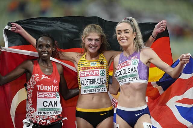 Silver medalist Yasemin Can, of Turkey, gold medalist Konstanze Klosterhalfen, of Germany and Eilish McColgan, of Great Britain, from left to right, pose after finishing the Women's 5000 meters during the athletics competition in the Olympic Stadium at the European Championships in Munich, Germany, Thursday, Aug. 18, 2022. (AP Photo/Martin Meissner)
