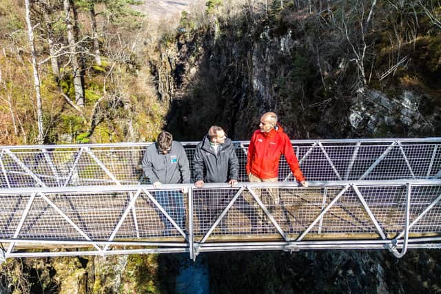 Visitors can gaze 100m down at the crashing waterfalls of the River Droma from the site’s Victorian suspension bridge which was built by Sir John Fowler in 1873 (National Trust Scotland)