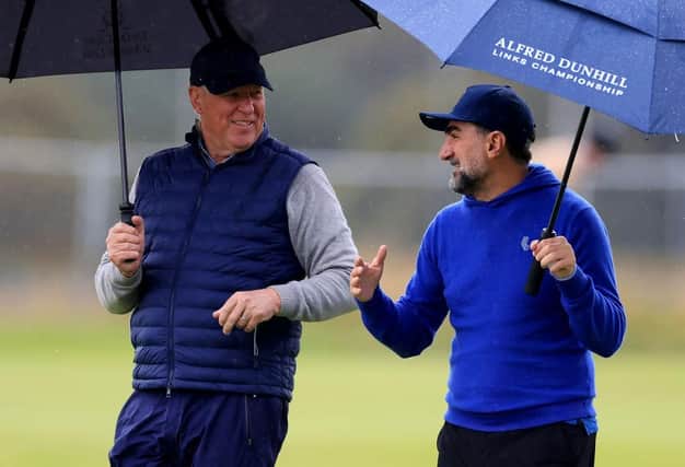 R&A chief executive Martin Slumbers chats to LIV Golf chairman Yasir Al-Rumayyan during their recent round together in the Alfred Dunhill Links Championship at St Andrews. Picture: Stephen Pond/Getty Images.