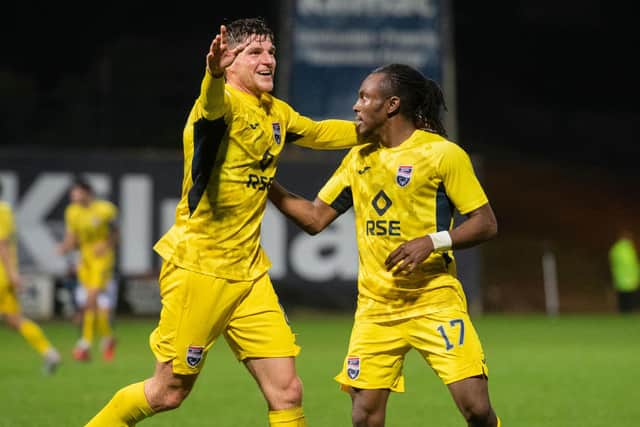 Ross Callachan (left) celebrates with Regan Charles-Cook after the latter notched Ross County's fifth goal on the night. Picture: SNS