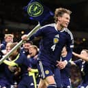 A jubilant Scott McTominay celebrates World Cup qualification after beating Denmark (Picture: Stu Forster/Getty Images)