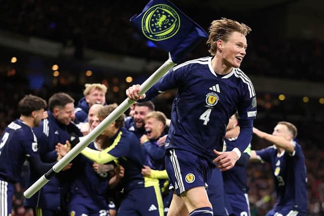 A jubilant Scott McTominay celebrates World Cup qualification after beating Denmark (Picture: Stu Forster/Getty Images)