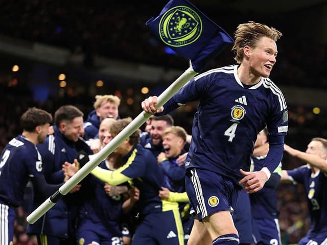 A jubilant Scott McTominay celebrates World Cup qualification after beating Denmark (Picture: Stu Forster/Getty Images)