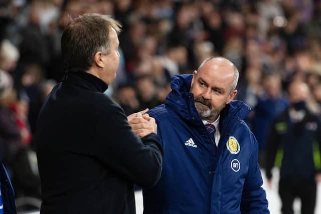 Denmark head coach Kasper Hjulmand and Steve Clarke embrace at full-time at Hampden. (Photo by Craig Foy / SNS Group)