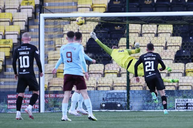 Craig Gordon tips the ball onto the post during an incredible triple save against Livingston on Sunday