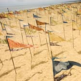 The Beach of Dreams Silks is a dynamic and travelling silk installation composed of hundreds of naturally-dyed pennants, each representing a personal story that reflects our relationship with the coast and sea.