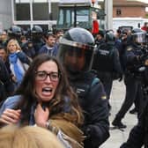 There were tense scenes outside some polling stations when Catalonia held its referendum on independence in defiance of the Spanish government in 2017 (Picture: Raymond Roig/AFP via Getty Images)