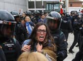 There were tense scenes outside some polling stations when Catalonia held its referendum on independence in defiance of the Spanish government in 2017 (Picture: Raymond Roig/AFP via Getty Images)