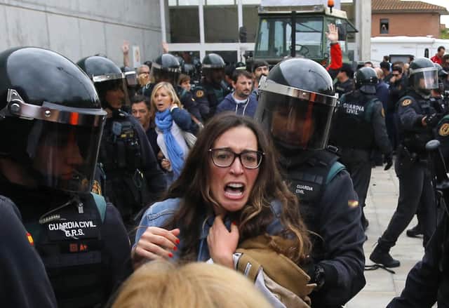 There were tense scenes outside some polling stations when Catalonia held its referendum on independence in defiance of the Spanish government in 2017 (Picture: Raymond Roig/AFP via Getty Images)