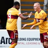 Motherwell's Mika Biereth (R) takes the plaudits from fellow sub Jon Obika after scoring his side's second goal v Hibs (Photo by Ross MacDonald / SNS Group)