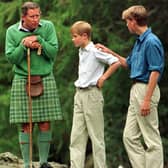 The Prince of Wales would holiday with his sons Prince William and Prince Harry to Scotland, as pictured at the Falls of Muick on the Balmoral estate.