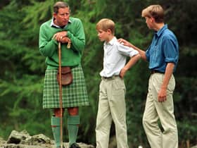 The Prince of Wales would holiday with his sons Prince William and Prince Harry to Scotland, as pictured at the Falls of Muick on the Balmoral estate.