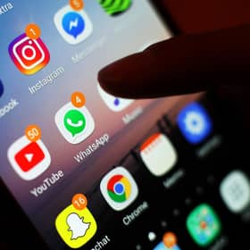 Social media apps displayed on a mobile phone screen. PIC: Yui Mok/PA Wire