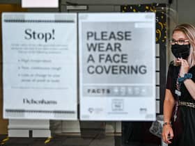 A shopper in Princes Street wears a mask.