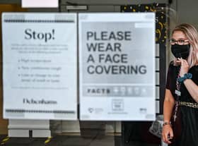 A shopper in Princes Street wears a mask.