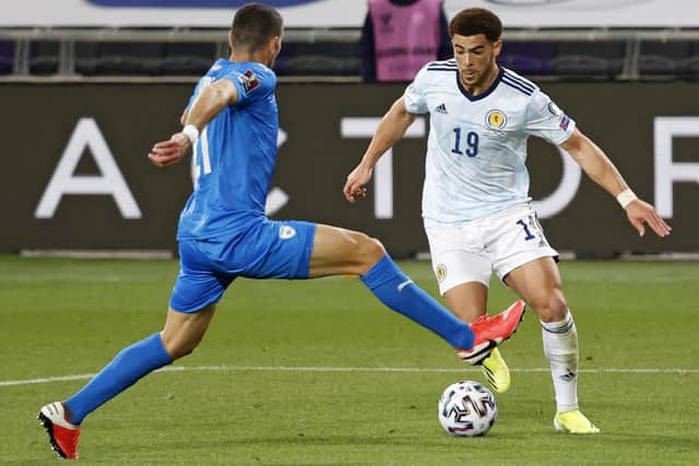 Scotland's forward Che Adams (R) is marked by Israel's defender Eitan Tibi during the 2022 FIFA World Cup qualifier group F football match between Israel and Scotland at Bloomfield stadium in the Israeli Mediterranean coastal city of Tel Aviv on March 28, 2021. (Photo by JACK GUEZ / AFP) (Photo by JACK GUEZ/AFP via Getty Images)