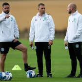Hibs coaching team of Jamie McAllister (L). Adam Owens and David Gray (R) during a training session at East Mains.
