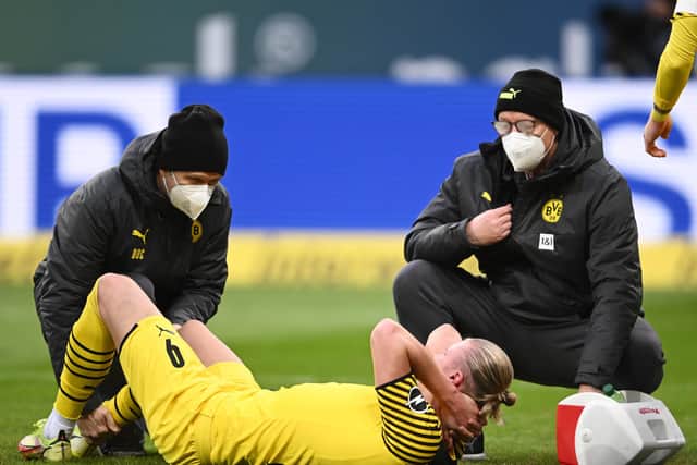 Borussia Dortmund striker Erling Haaland receives treatment for the injury he suffered against Hoffenheim last month and which will see him still sidelined for Thursday night's Europa League game against Rangers at Ibrox. (Photo by Alexander Scheuber/Getty Images)