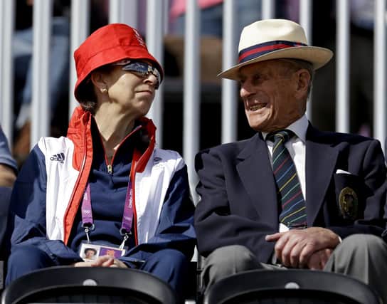 Princess Anne, left, attends the equestrian eventing dressage phase with her father Prince Phillip the Duke of Edinburgh, husband of Britain's Queen Elizabeth II, at the 2012 Summer Olympics, in London. (AP Photo/David Goldman, FIle)