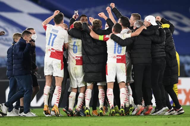 Slavia Prague players and staff celebrate at the King Power Stadium after beating Leicester City in their Europa League round of 32 tie. (Photo by Michael Regan/Getty Images)
