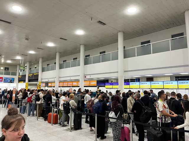 Queues at Gatwick South Terminal at 10:39hrs on Wednesday. More than 150 UK flights were cancelled on Wednesday and passengers who could travel were forced to wait in long queues at airports. Picture date: Wednesday June 1, 2022.
