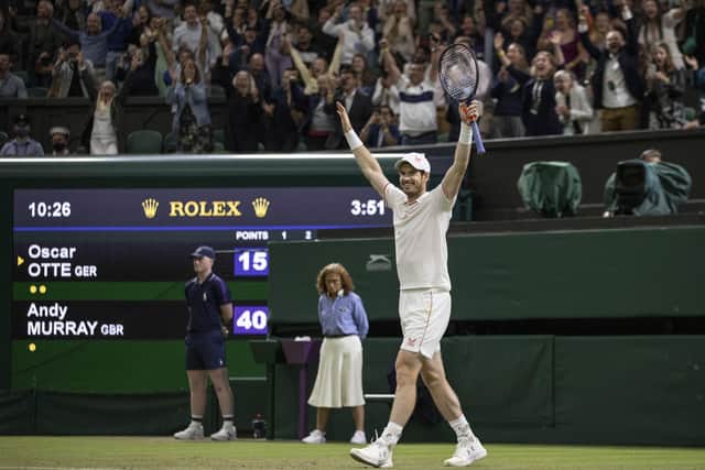 Andy Murray waves to the crowd after defeating Oscar Otte