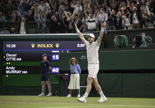 Andy Murray waves to the crowd after defeating Oscar Otte