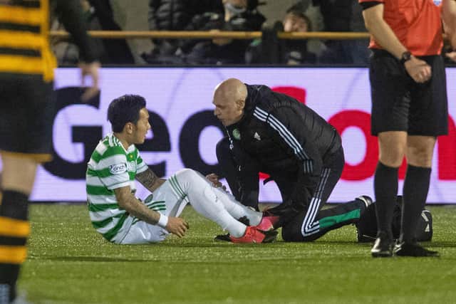 Celtic's Yosuke Ideguchi goes down injured during the Scottish Cup tie against Alloa.