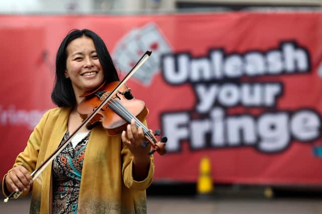A Festival Fringe entertainer performs on the Royal Mile. Picture: Jeff J Mitchell/Getty Images