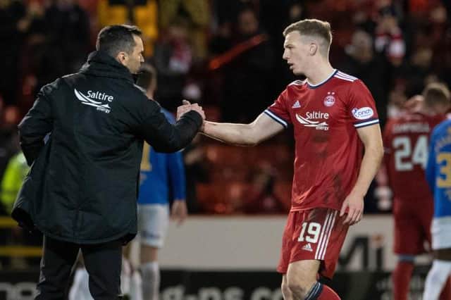 Aberdeen manager Stephen Glass (left) with Lewis Ferguson at full time after the Premiership match between Aberdeen and Rangers at Pittodrie. (Photo by Ross Parker / SNS Group)