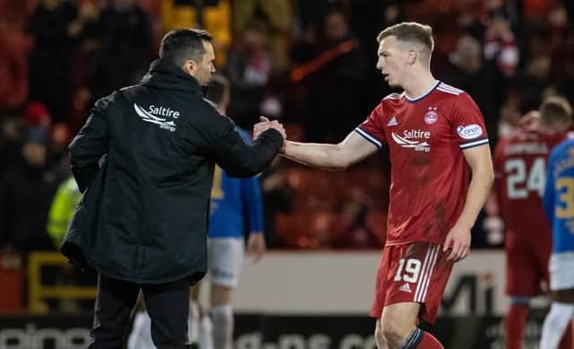Aberdeen manager Stephen Glass (left) with Lewis Ferguson at full time after the Premiership match between Aberdeen and Rangers at Pittodrie. (Photo by Ross Parker / SNS Group)