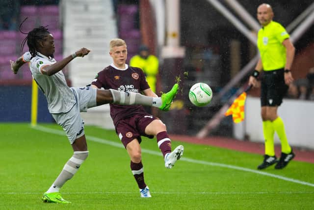 Istanbul Basaksehir's Bertrand Traore pokes the ball away from Hearts Alex Cochrane during a UEFA Europa Conference League match between the two clubs.