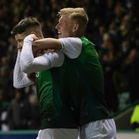 Kevin Nisbet sticks his fingers in his ears as he celebrates with Josh Doig after his winning goal for Hibs against Cove Rangers on January 20. (Photo by Craig Foy / SNS Group)