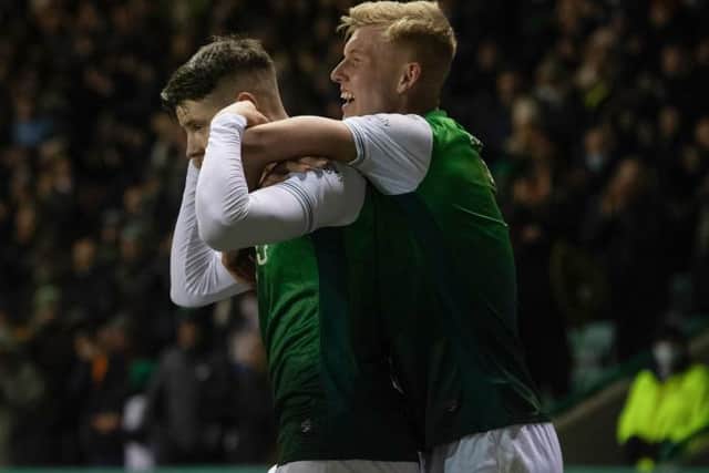 Kevin Nisbet sticks his fingers in his ears as he celebrates with Josh Doig after his winning goal for Hibs against Cove Rangers on January 20. (Photo by Craig Foy / SNS Group)