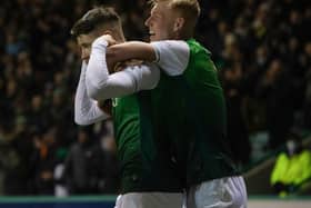 Kevin Nisbet sticks his fingers in his ears as he celebrates with Josh Doig after his winning goal for Hibs against Cove Rangers on January 20. (Photo by Craig Foy / SNS Group)