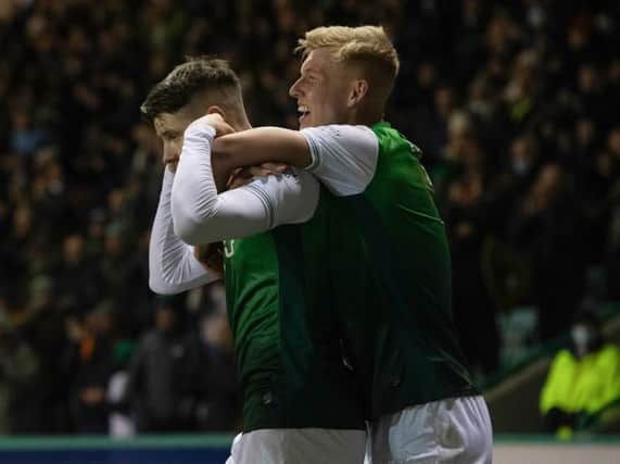 Kevin Nisbet sticks his fingers in his ears as he celebrates with Josh Doig after his winning goal for Hibs against Cove Rangers on January 20. (Photo by Craig Foy / SNS Group)