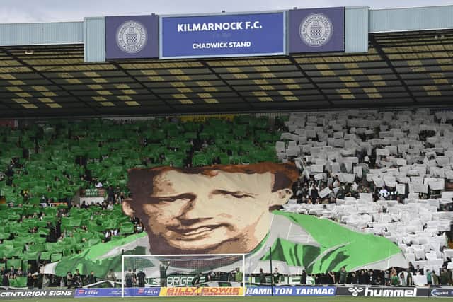 Celtic fans hold up a tifo of Tommy Burns with a banner which reads 'You're playing for a people and a cause'. (Photo by Rob Casey / SNS Group)