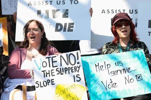 Opponents of legislation to legalise assisted dying demonstrate outside the Scottish Parliament (Picture: Jeff J Mitchell/Getty Images)