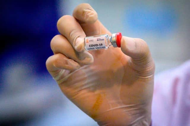 It could be some time before the world returns to 'normal', even in the face of successful vaccines (Photo: MLADEN ANTONOV/AFP via Getty Images)