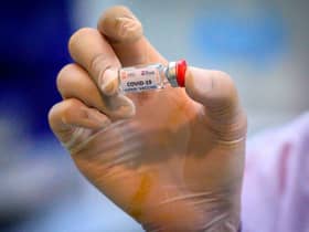 It could be some time before the world returns to 'normal', even in the face of successful vaccines (Photo: MLADEN ANTONOV/AFP via Getty Images)
