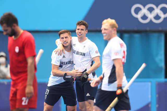Liam Ansell and Phil Roper celebrate victory over Canada at the Oi Hockey Stadium