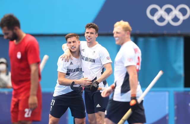 Liam Ansell and Phil Roper celebrate victory over Canada at the Oi Hockey Stadium