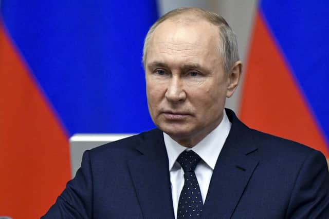 Vladimir Putin's eyes appeared to glaze over while speaking to Alexander McCall Smith (Picture: Alexei Danichev/Sputnik/Kremlin pool photo via AP)