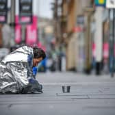 A homeless man sit in Buchanan Street. Picture: Jeff J Mitchell/Getty Images