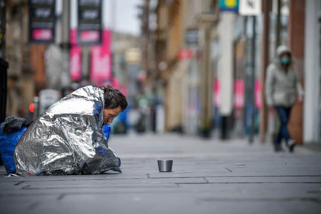 A homeless man sit in Buchanan Street. Picture: Jeff J Mitchell/Getty Images