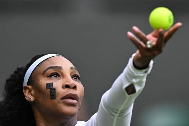 US player Serena Williams wearing plasters on her face during the match with France's Harmony Tan at Wimbledon 2022 (Photo by GLYN KIRK/AFP via Getty Images)