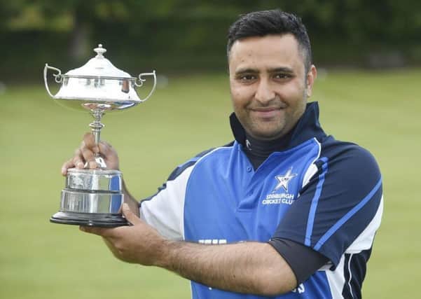 Kashif Hussain, who works as a representative for a Fleet Management Company, is pictured with the Masterton T:20 Trophy. Picture: Contributed